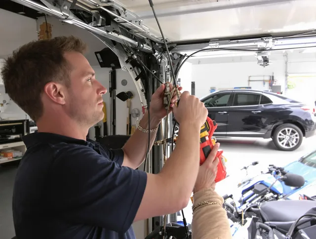 North Branford Garage Door Repair safety certified technician performing cable replacement in North Branford