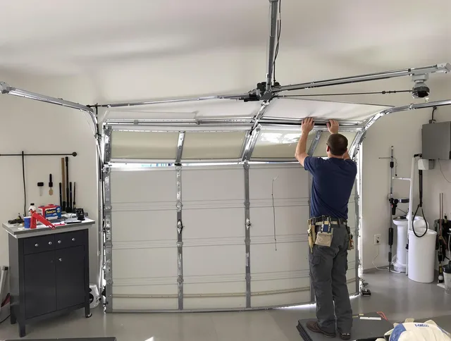 North Branford Garage Door Repair specialist performing precise section replacement on North Branford garage door